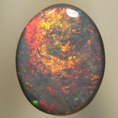 SOLID SEMI BLACK OPAL Red and orange moves constantly over green 